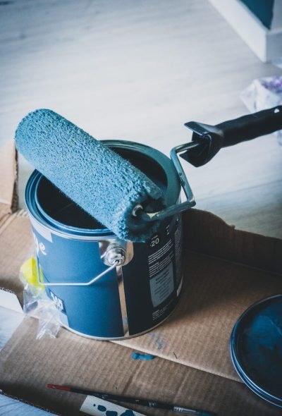 blue and white can on white table